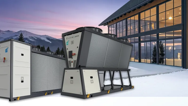 Systemair chillers installed on a plant deck beside a glazed building at dusk.